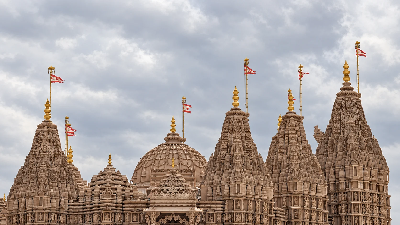 Боковой силуэт BAPS Mandir с резными башнями и центральным куполом